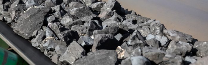 Close up of Manganese rock being moved on a conveyor belt